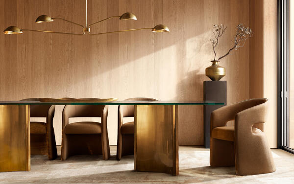 Dalton dining table in glass and lacquered brass shown with the Gia dining chair