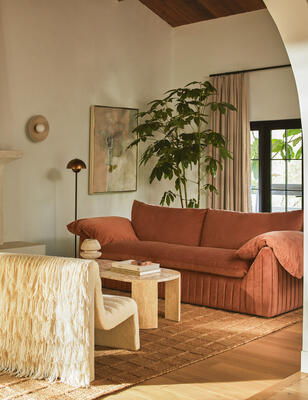 The Yucca sofa, Mahoe oval coffee table and Leon chair by Carly Cushnie for Lulu and Georgia