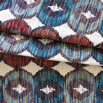 This modern, multicolor statement jacquard is derived from classic ikat motifs and constructed from an extravagant mix of specialty boucle yarns. A contemporary bohemian classic, Costume is available in four colorways: Horizon, Orchard, Rainforest and Topaz 					