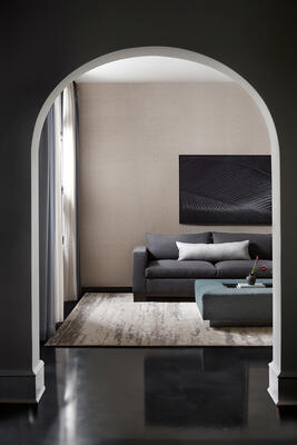 Bene Weave wallcovering, sofa in Hamilton Wool, pillow in Ana, ottoman in Gramercy Park