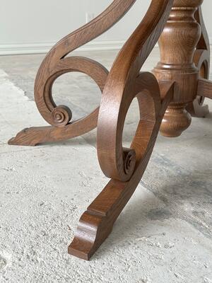 Scroll leg detail of the Provincial Louis XV–style dining table
