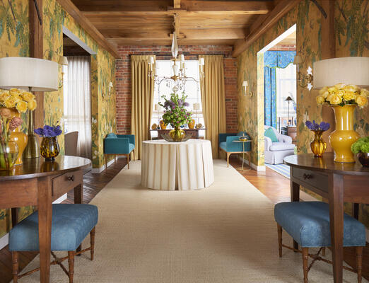 Montecito rug, Wild Wisteria mural wallcovering, draperies in Dorset fabric, shade in Lanai fabric, table skirt in Beckley Stripe fabric with pleats and welt in Holden Stripe fabric, Dorset benches in Miles mohair velvet, Eaton ottoman in Crete fabric
