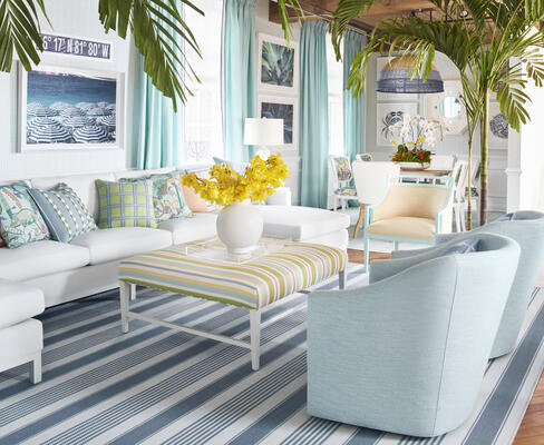 Nantucket rug; Coastline wallcovering; Frampton sectional sofa in Melina matelassé fabric; pillows in Iggy, Cameron with Westport tape, Tessa with Nordia tape, Tessa with Surrey cord and Westport tape, Turtle Bay and Tessa fabric with Surrey cord; Malibu chair in Finely; Harper chair with swivel in Finely; Keller ottoman in Kalea Stripe