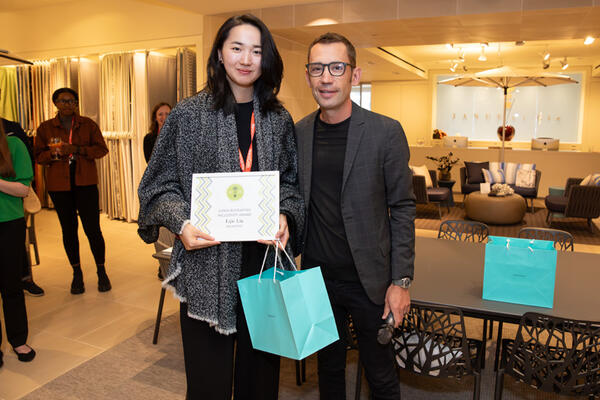 Olivia Bloomfield Inclusivity Award recipient Lijie Liu of ArtCenter College of Design with competition judge Adam Stover of Populous