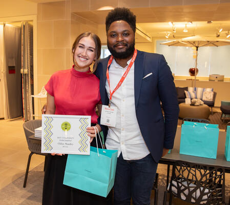 Best Community Enrichment Award recipient Chloe Stanley of the University of North Carolina at Greensboro with competition champion Christopher Locke of Designing in Color