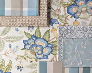 Davenport in Pacific and Iris embroidery in Aqua among Lee Jofa wovens and stripes