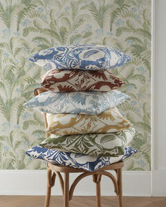 From top, Calathea in Blue, Red, Aqua, Gold, Leaf and Indigo pillows, Pashley wallcovering in Sky