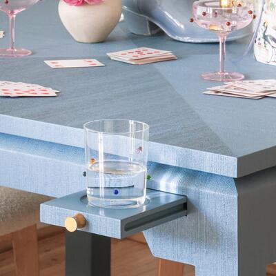 Pop-out drink holders keep the table clear for games