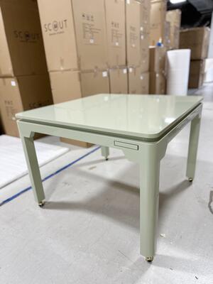 Custom game table in green lacquer with casters