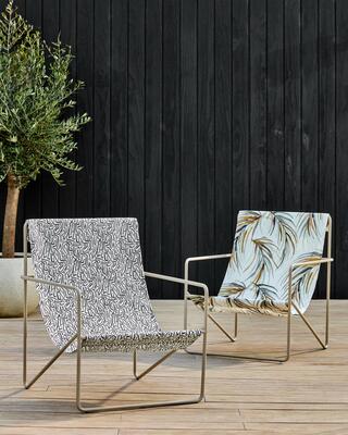 Mini Melodic (front) and Alvaro (back) outdoor fabrics add performance and style to chic patio chairs