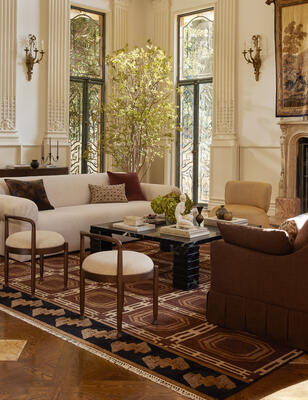 Mixing linen, marble and boucle adds textural depth to a living room