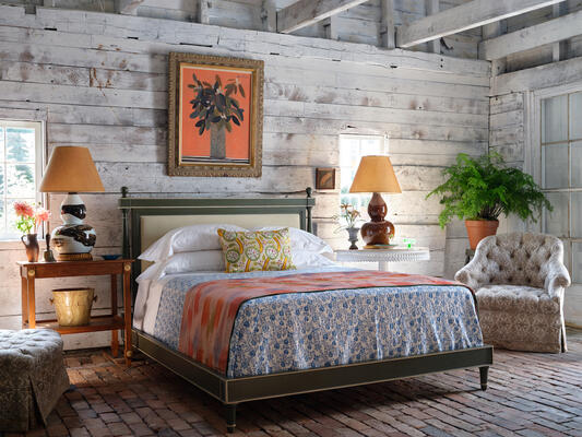 A painted gray-green finish with off-white painted trim defines the Empire bed 