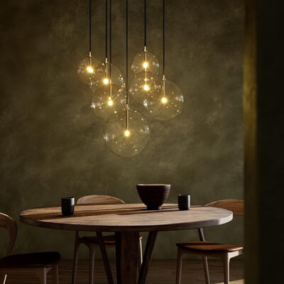 Each globe in the Cluster 7 Mix chandelier is individually blown, shaped and sculpted by hand by the experts at Schwung