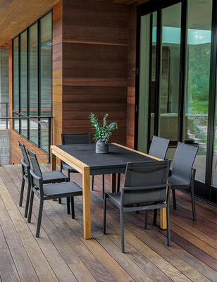 Summit teak and aluminum infinity table with Sola dining chairs