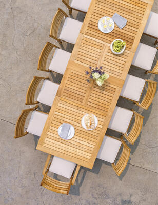 Calypso teak extension table with Calypso teak arm- and side chairs