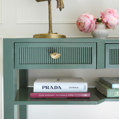 A second shelf doubles the styling potential of the High n’ Tight console, while brass hardware adds a touch of luxury