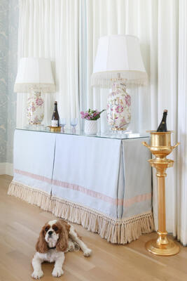 The Cambridge console table is available in custom skirted options, complete with a glass top