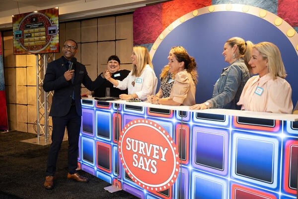 Co-host Melvin Hooks with the winning team, comprised of Fabricut's Laura Smith and designers Amanda Chando, Barbi Stalburg Kasoff, Samantha Freidman, Stacey Dobrovolny and Annie Staley