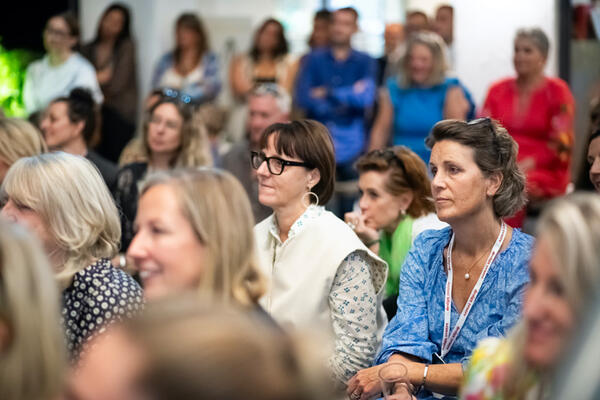 Crowd listening to the presentation