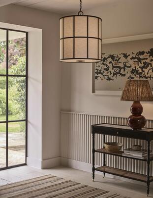 A steel frame encases a linen shade and frosted diffuser to create the warm light of the Ashmore shade lantern