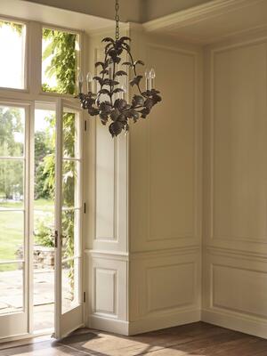 Inspired by a Parisian antique, the Compiegne Leaf chandelier is finished with distressed green paint