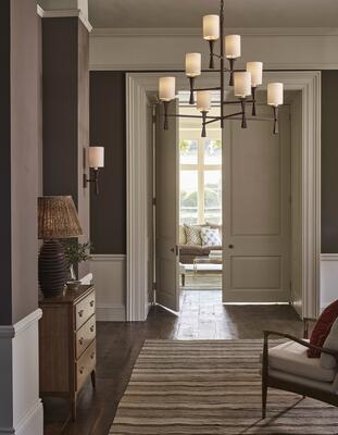 The Corfe chandelier draws inspiration from a midcentury geometric sculptured candlestick 