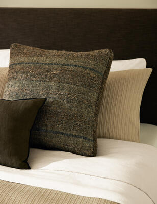 Inspired by earthy tones, the Teku pillow was designed to provide a grounding touch