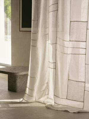 Sheer linen patches are arranged by hand in Cento’s soft geometric patchwork