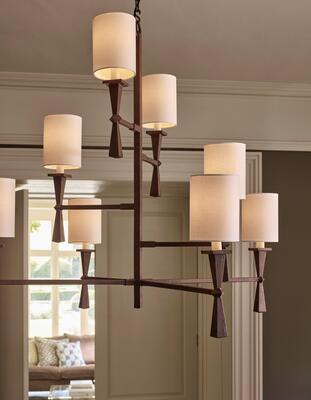 A painted rust-effect finish adds depth and gravitas to the angular form of the Corfe chandelier