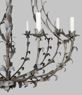 Decorative pressed leaves highlight the graceful arms and candle cups of the Anjou chandelier