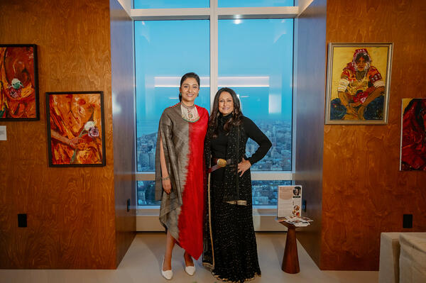 Soni Mehra with artist Malika Garrett and her displayed works