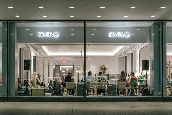 View of the Frato showroom and panel discussion from the outside looking in