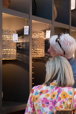 Guests admiring Surya's expansive lighting selections