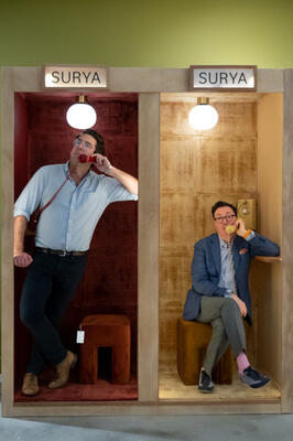 Fred Nicolaus and Dennis Scully having fun in the Surya phone booth