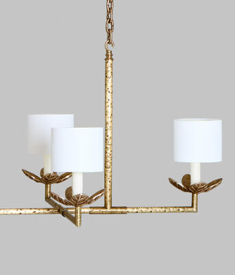 Hand-applied pitted metalwork adds texture to the lively, contemporary Antibes chandelier