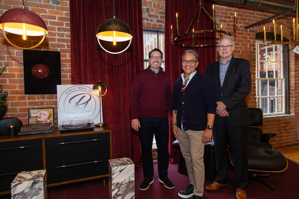 Robert Abbey’s Nathan Hedrick (left) and John Kay (right) with Michael Almodova-Sorensen of Mavisten Edition (center). The trio poses with pieces from the Carbonia and Copernica collections, which were designed in collaboration with Mavisten Edition