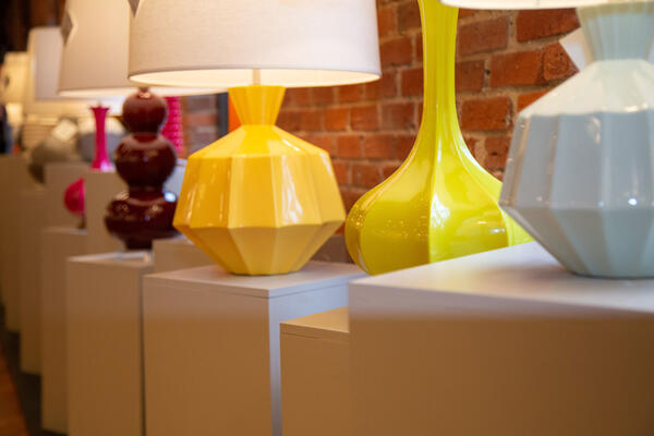 Ceramic lighting offerings including the Triple Gourd table lamp in Sangria, the Orion accent lamp in Sunset Yellow, the Pike table lamp in Citron and the Orion table lamp in Celadon