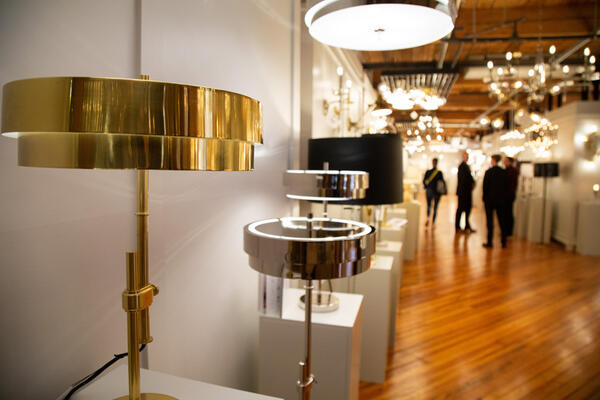 The new Elliott collection of table lamps, floor lamps, flush mounts and pendants is offered in modern brass or polished nickel