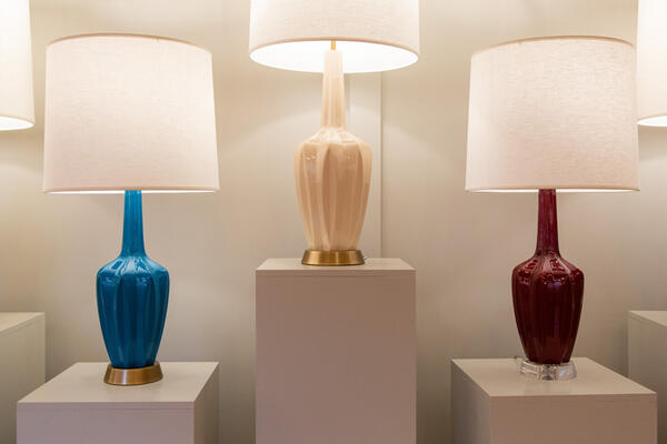 The Emma table lamp from the Custom collection, shown in Cobalt, Bone, and Sangria