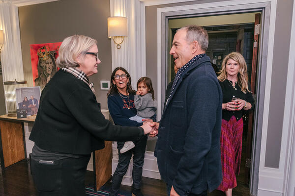 Jean Armstrong greets Steven Plofker, owner of The George, while Bobbi Brown looks on with her daughter