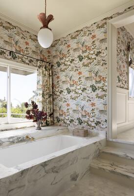 A primary bath where the view and the wallpaper are the stars.