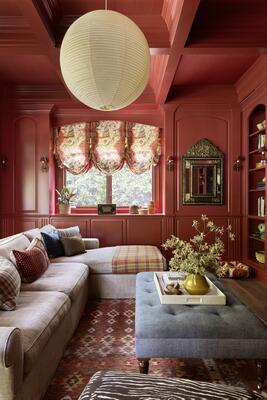 Our clients wanted a "red room" for television watching. We added the mouldings and all the details.
