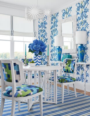 Mangrove Tree wallcovering, Kelby Chair in Pixel, and AREAS rug in Newport