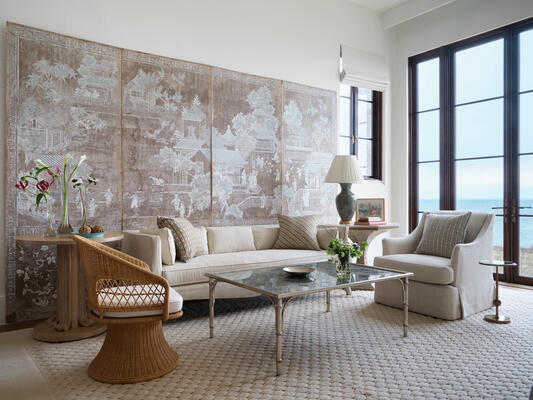 The Celine coffee table has an antiqued mirrored glass top that’s hand-painted on the reverse 