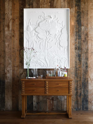 The new Conservatory plaster panel hangs above the new Haverland console, which serves as the perfect cocktail bar
