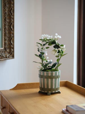 Also available in a planter size, the Stripe cachepot features alternating gray and green stripes that are hand-painted and aged to perfection