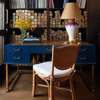 The lacquer Alix desk is inspired by the practical lines of campaign furniture