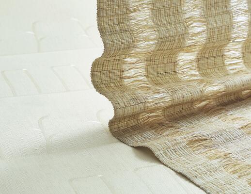 Tove handwoven windowcovering paired with Grace natural wallcovering