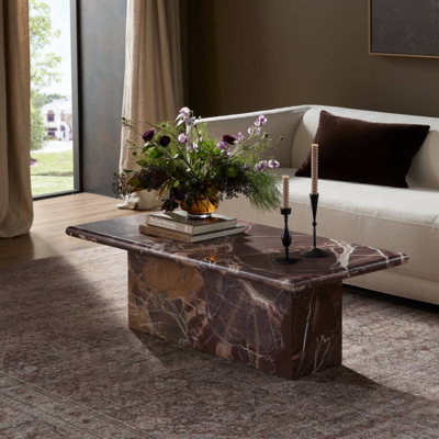 Inspired by 1970s Italian design, the monolithic Arum coffee table is made from solid marble in a unique wine-red hue