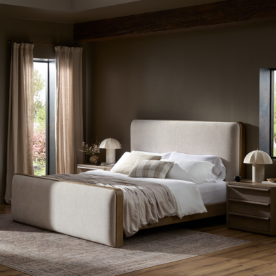 Subtly rounded corners, aged solid oak frames, and upholstered head and foot boards give the Pierce bed its soft, inviting contours